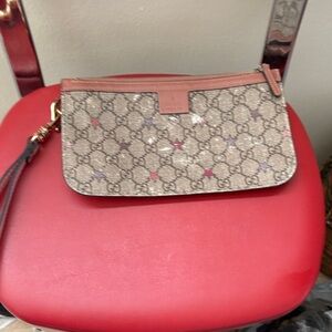 Gucci Pink Starz Monogram Wristlet authentic ! strap is not Gucci brand !